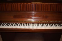 Lot 1234 - A Yamaha upright piano in mahogany case in...