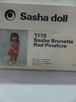 Lot 13 - A Sasha doll, brunette in red pinafore, 111S,...