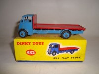 Lot 198 - A Dinky Toys Guy flat truck, 432, with light...