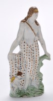 Lot 369 - Pearlware figure of ''Venus'', standing in...