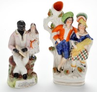 Lot 381 - Staffordshire flat back figure of Uncle Tom...