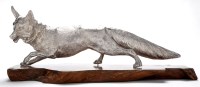 Lot 545 - An Elizabeth II large model of a fox, resting...