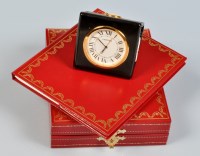 Lot 678 - Cartier: a travel clock, with circular roman...