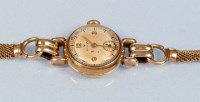 Lot 684 - Rolex: a lady's 9ct. gold bracelet watch, the...