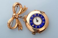 Lot 687 - A 9ct. gold cased fob watch, of half hunter...