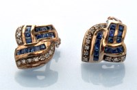 Lot 706 - A pair of sapphire and diamond earrings, set...