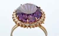 Lot 707 - An amethyst and diamond cluster ring, the...