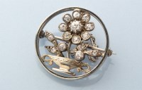 Lot 709 - An Edwardian diamond brooch, of roundel form,...