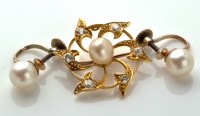 Lot 713 - A diamond and pearl set brooch, of fan design...