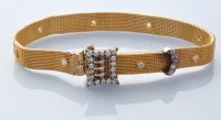 Lot 715 - A fine diamond set yellow metal mesh buckle...