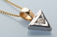 Lot 717 - A diamond set 9ct. white gold triangular form...