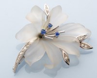 Lot 725 - A diamond, sapphire and cut glass flower...