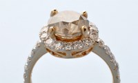 Lot 729 - A diamond ring, the central brilliant cut...