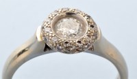 Lot 733 - A diamond cluster ring, the central brilliant...