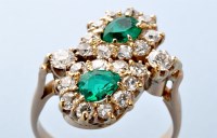 Lot 734 - An emerald and diamond ring, the two pear cut...