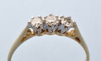 Lot 738 - A three-stone diamond ring, the three...