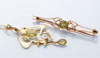 Lot 755 - An Edwardian peridot and seed pearl drop...