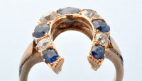 Lot 758 - A sapphire and diamond horseshoe pattern ring,...