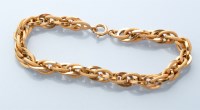 Lot 762 - An 18ct. yellow gold bracelet, of oval...