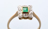 Lot 763 - An emerald and diamond cluster ring, the...