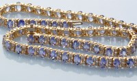 Lot 769 - A tanzanite and diamond necklace, the sixty...