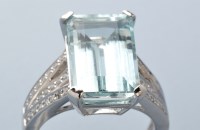 Lot 770 - An aquamarine and diamond ring, the emerald...