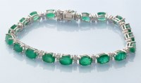 Lot 772 - An emerald and diamond bracelet, the nineteen...