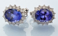 Lot 774 - A pair of tanzanite and diamond cluster...