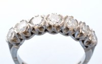 Lot 788 - A seven stone diamond ring, the brilliant cut...