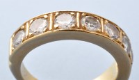 Lot 789 - A seven stone diamond ring, the brilliant cut...