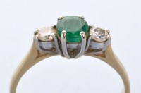 Lot 795 - An emerald and diamond ring, the circular...