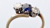 Lot 796 - A sapphire and diamond ring, the circular...