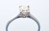 Lot 800 - A solitaire diamond ring, the cushion cut...