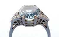 Lot 804 - An aquamarine and diamond ring, the oval facet...