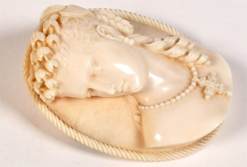 Lot 812 - A Victorian carved ivory cameo depicting a...