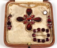 Lot 814 - A Victorian garnet cross pattern pendant, set...