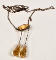 Lot 815 - An Edwardian citrine necklace, the oval facet...