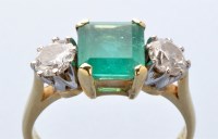 Lot 820 - An emerald and diamond ring, the square facet...