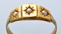 Lot 823 - A pearl and gold ring, three small half pearls...