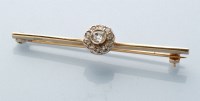 Lot 839 - A diamond cluster bar brooch, the central old...