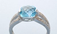 Lot 842 - A blue topaz and diamond ring, the square...