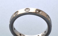 Lot 843 - A diamond set eternity ring, set with ten...