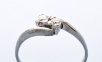 Lot 844 - A two stone diamond ring, the eight-cut stones...