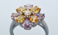 Lot 845 - A pink and yellow sapphire and diamond ring,...