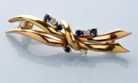 Lot 846 - A sapphire, diamond and gold brooch, the 18ct....