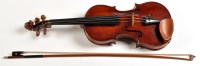 Lot 1043 - A cased violin and bow, the violin labelled...