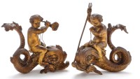 Lot 1053 - A pair of Ormolu figurines of cherubs riding...