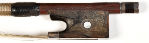 Lot 1089 - An octagonal violin bow, by William E. Hill &...