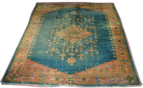 Lot 1110 - An antique Ushak carpet, the diamond-shaped...