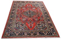 Lot 1111 - A Lilian carpet, the claret ground decorated...